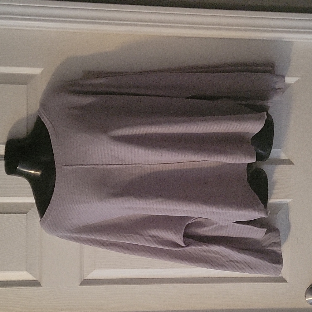 Brand new. Never worn. Grey light long sleeved top XL